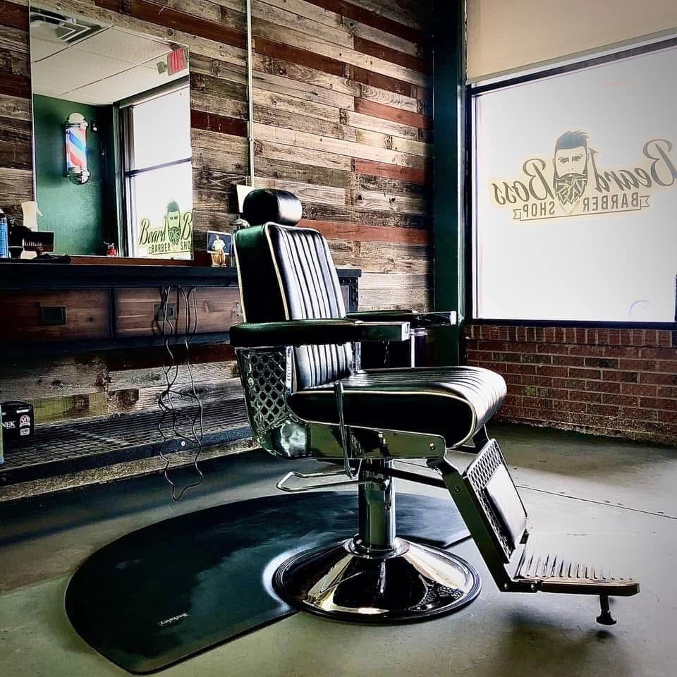 Traditional black leather barber chair at our professional grooming shop in Rockwall, TX.